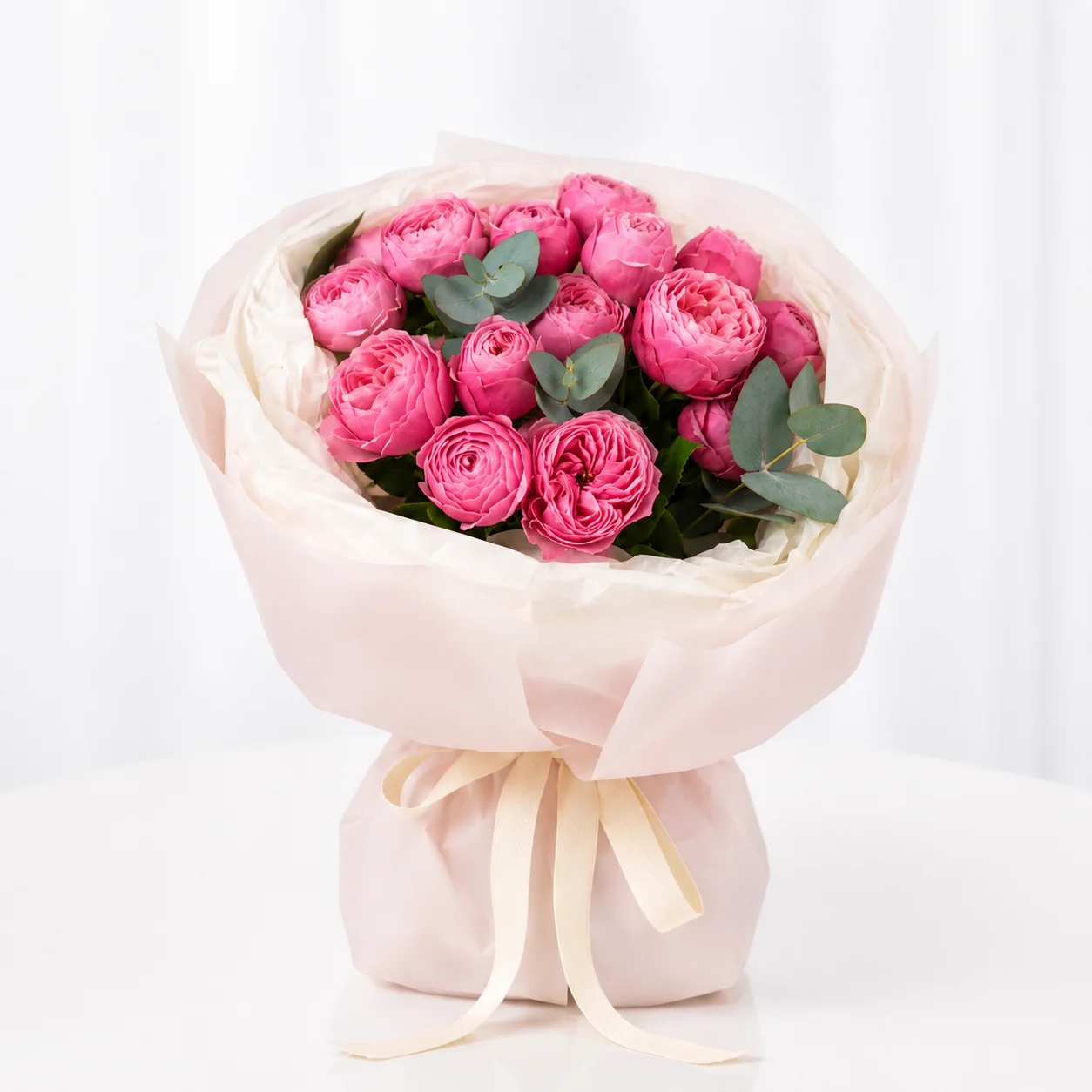 Fresh Silva Pearl 7 pink peony roses wrapped in luxurious white floral paper with satin ribbon